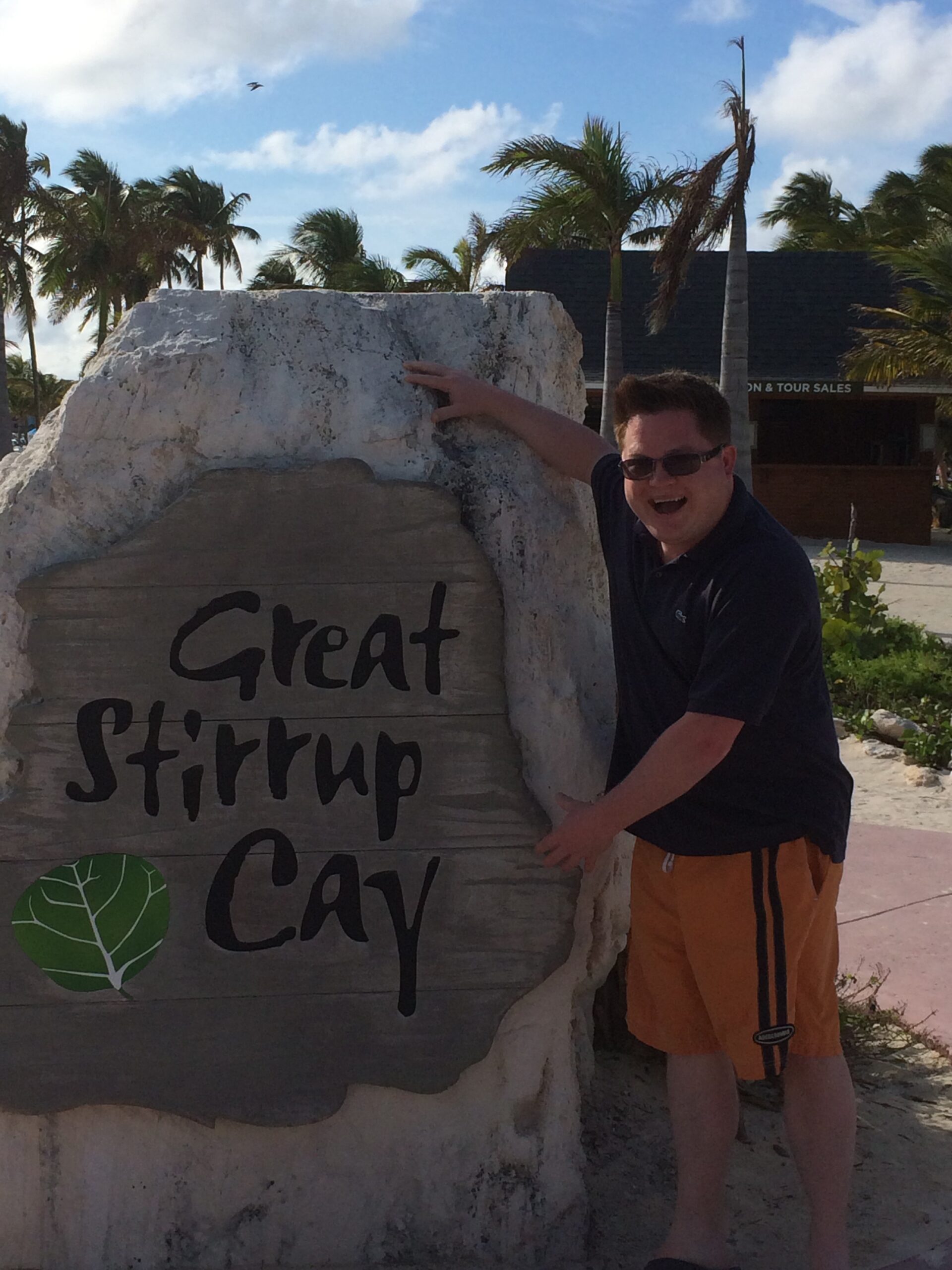 21 Things Nobody Tells You Before Your First Cruise (Learned the Hard Way) Posing next to the Great Stirrup Cay sign