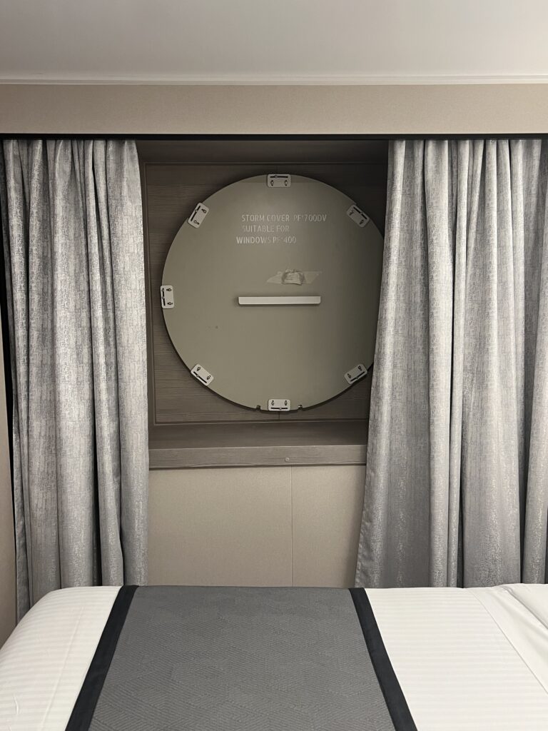 I Was on NCL Aqua's First-Ever Sailing — Here's the Theater Turning Into a Nightclub Steel storm cover bolted over the stateroom window